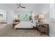Bright main bedroom featuring plush carpet, a ceiling fan, and lots of natural light at 2485 S Fillmore St, Denver, CO 80210