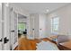 Office with hardwood floors and french doors leading to the living room at 2485 S Fillmore St, Denver, CO 80210