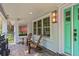 Charming porch with stylish tile, outdoor lighting, and comfortable seating at 2485 S Fillmore St, Denver, CO 80210