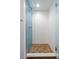Modern shower space featuring white subway tile and blue glass mosaic accent wall at 2485 S Fillmore St, Denver, CO 80210