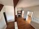 Warm and inviting entryway showcasing hardwood floors and a charming decorative fireplace at 114 E 2Nd Ave, Denver, CO 80203