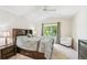 Bedroom with ceiling fan, neutral walls and carpet, and large window at 6404 Silver Mesa Dr # E, Highlands Ranch, CO 80130