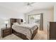 Bedroom with ceiling fan, neutral walls and carpet, and large window at 6404 Silver Mesa Dr # E, Highlands Ranch, CO 80130