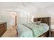 Bedroom with ceiling fan, neutral walls and carpet, and large closet at 6404 Silver Mesa Dr # E, Highlands Ranch, CO 80130