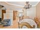 Inviting dining area with fireplace, chandelier, and wood floors at 6404 Silver Mesa Dr # E, Highlands Ranch, CO 80130