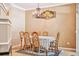 Elegant dining room with a chandelier, hardwood floors, and stylish decor at 6404 Silver Mesa Dr # E, Highlands Ranch, CO 80130