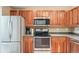 Traditional kitchen with stainless steel appliances and wooden cabinets at 6404 Silver Mesa Dr # E, Highlands Ranch, CO 80130