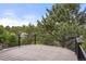 Enjoy outdoor living on this deck with black railings and a beautiful view of the surrounding trees at 5812 Irish Pat Murphy Dr, Parker, CO 80134