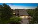 Beautiful two-story home with a well-manicured lawn, lush landscaping, and an attached two-car garage at 5812 Irish Pat Murphy Dr, Parker, CO 80134