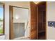 Hallway features a glass-enclosed shower and an adjacent sauna for relaxing in the privacy of your own home at 5812 Irish Pat Murphy Dr, Parker, CO 80134