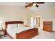 Relax in this spacious main bedroom with vaulted ceiling, fan, and plenty of natural light at 5812 Irish Pat Murphy Dr, Parker, CO 80134