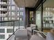 Cozy outdoor balcony featuring modern furniture and striking city views, providing a serene retreat at 1750 Wewatta St # 1501, Denver, CO 80202