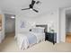 Cozy bedroom with modern decor featuring a ceiling fan and a view into the closet at 1750 Wewatta St # 1501, Denver, CO 80202