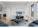 Living room featuring stylish seating, modern lighting, and chic decor on hardwood floors at 1750 Wewatta St # 1501, Denver, CO 80202