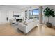 Bright living room featuring stylish seating, city views, modern lighting, and chic decor on hardwood floors at 1750 Wewatta St # 1501, Denver, CO 80202