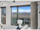 A bright living room featuring expansive windows with city views and a stylish concrete column at 1750 Wewatta St # 1501, Denver, CO 80202