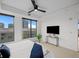 Bright main bedroom featuring stylish decor, city views, and a modern ceiling fan at 1750 Wewatta St # 1501, Denver, CO 80202