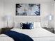 Close-up of main bedroom featuring stylish decor and a decorative headboard at 1750 Wewatta St # 1501, Denver, CO 80202
