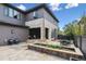 Charming backyard featuring a stone patio, a dining area, and a lovely flower bed, perfect for outdoor enjoyment at 8565 E 50Th Dr, Denver, CO 80238