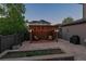 Charming backyard with a cozy pergola and outdoor seating creating a peaceful and inviting retreat at 8565 E 50Th Dr, Denver, CO 80238