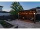 Charming backyard with a cozy pergola and outdoor seating creating a peaceful and inviting retreat at 8565 E 50Th Dr, Denver, CO 80238