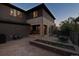 Beautiful backyard featuring a stone patio, dining area, and flower bed for outdoor enjoyment and relaxation at 8565 E 50Th Dr, Denver, CO 80238