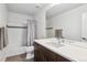 Clean bathroom with a shower-tub combination, vanity with double sinks, and modern fixtures at 8565 E 50Th Dr, Denver, CO 80238