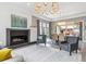 Open-concept dining room with fireplace and sliding door at 8565 E 50Th Dr, Denver, CO 80238