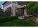 Charming outdoor patio with green lawn, stylish stone and brick accents, and cozy seating area at 8565 E 50Th Dr, Denver, CO 80238