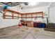 Spacious garage with shelving units offering ample storage space for tools and equipment at 8565 E 50Th Dr, Denver, CO 80238