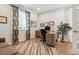 Bright home office with hardwood floors, ample desk space, and natural light at 8565 E 50Th Dr, Denver, CO 80238