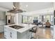 Spacious kitchen island with cooktop range in an open floor plan at 8565 E 50Th Dr, Denver, CO 80238