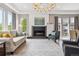 Sun-filled living room features a decorative fireplace and recessed lighting at 8565 E 50Th Dr, Denver, CO 80238