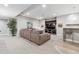 Basement area features a wet bar, cozy seating, and a large entertainment center at 8565 E 50Th Dr, Denver, CO 80238