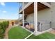 Backyard featuring synthetic grass, a hot tub and patio furniture for outdoor relaxation at 15020 Cast Pebble Cir, Parker, CO 80134