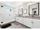 Modern bathroom with glass-enclosed shower, double vanity with sleek countertops, and contemporary fixtures at 15020 Cast Pebble Cir, Parker, CO 80134