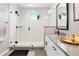 Contemporary bathroom with walk-in shower, black hardware, modern sink, and eye-catching checkerboard rug at 15020 Cast Pebble Cir, Parker, CO 80134