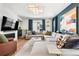 Bright living room boasts hardwood floors, large sectional sofa, modern fireplace, and stylish decor at 15020 Cast Pebble Cir, Parker, CO 80134