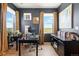 Spacious home office featuring a large desk, ample storage, and natural light for productivity at 15020 Cast Pebble Cir, Parker, CO 80134