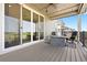 Relaxing covered patio with comfortable seating, a ceiling fan, and views of the surrounding landscape at 15020 Cast Pebble Cir, Parker, CO 80134