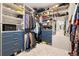 Organized walk-in closet with custom shelving, drawers, and ample space for clothes and accessories at 15020 Cast Pebble Cir, Parker, CO 80134