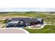 Aerial view features the community clubhouse showcasing modern architecture and well-maintained grounds at 1041 W Witherspoon Dr, Elizabeth, CO 80107