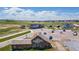 Overhead shot of neighborhood amenities with a clubhouse, parking, and a charming barn at 1041 W Witherspoon Dr, Elizabeth, CO 80107