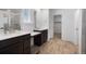Elegant bathroom featuring double sinks, a vanity, and a shower at 1041 W Witherspoon Dr, Elizabeth, CO 80107