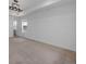 Expansive bedroom with neutral carpet, tray ceiling, and ample natural light from two windows at 1041 W Witherspoon Dr, Elizabeth, CO 80107