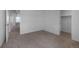 Neutral bedroom with an adjoining closet and bathroom at 1041 W Witherspoon Dr, Elizabeth, CO 80107