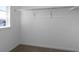 Interior view of a walk-in closet with a clothing rod and trim, with a view of exterior at 1041 W Witherspoon Dr, Elizabeth, CO 80107
