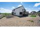 Well-maintained two-story house featuring a stylish porch and landscaped surroundings at 1041 W Witherspoon Dr, Elizabeth, CO 80107