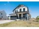 Charming two-story home with modern gray and white color scheme and attached two-car garage at 1041 W Witherspoon Dr, Elizabeth, CO 80107