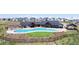 Aerial view of community pool and amenity center, surrounded by nature at 1041 W Witherspoon Dr, Elizabeth, CO 80107